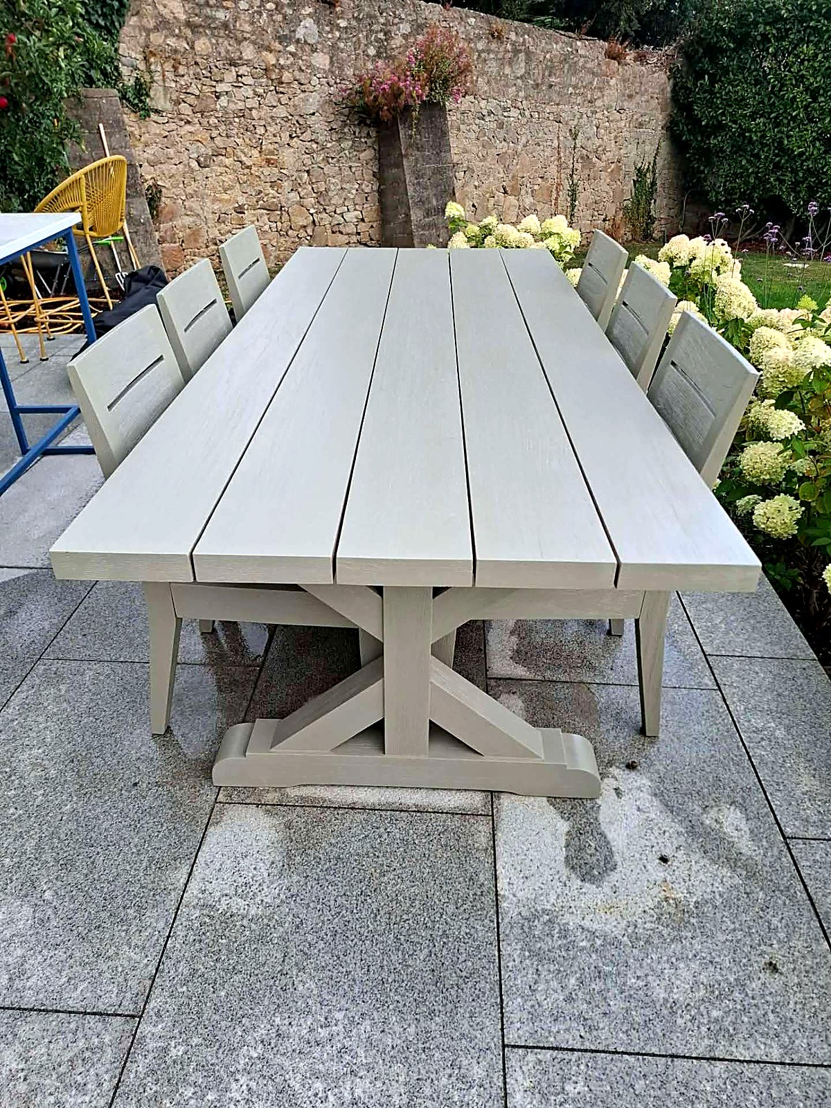 After: garden table and chairs restored in soft sage green