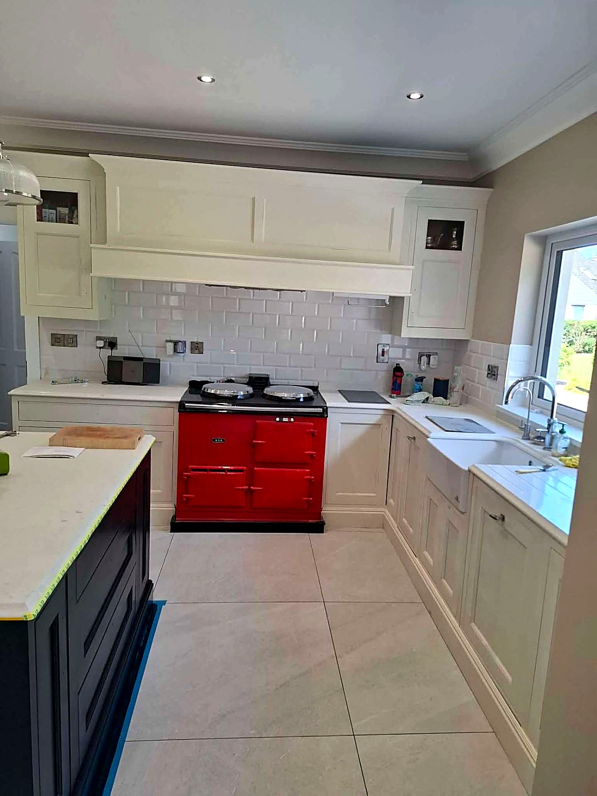 Before: cream painted kitchen and mantle over the red range cooker